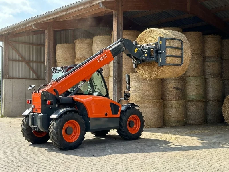 T4512 Telehandler handling bales on farm