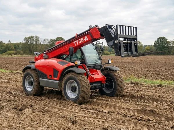 T735-A telehandler on soft farm ground