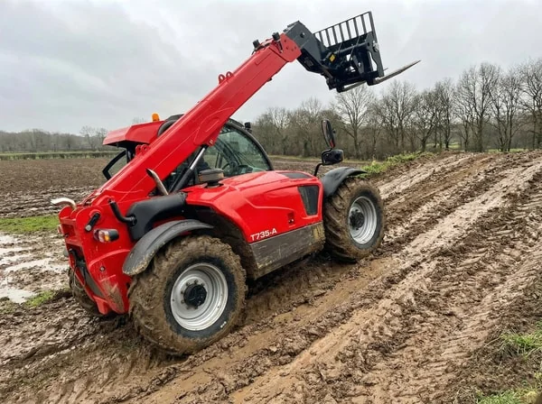 Telehandler working in muddy conditions