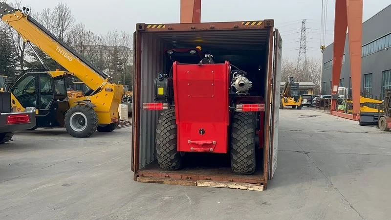 Telehandler loading into shipping container